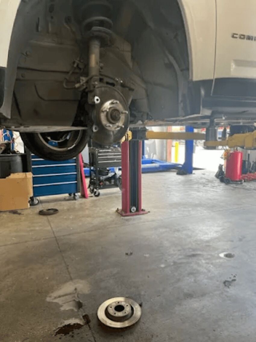 Wheel removed for brake and suspension work at Northwest Express Auto Care