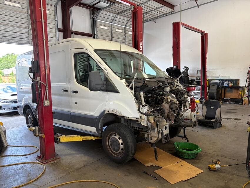 Ford Transit on the lift at Northwest Express Auto Care