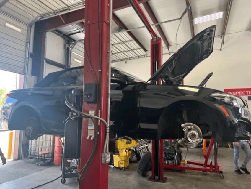 Vehicle on a lift for transmission work at Northwest Express Auto Care in Katy, TX